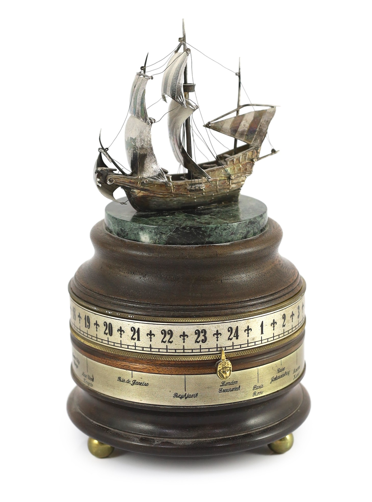 A Charles Frodsham for The St James's House Company. A silvered brass, marble and mahogany revolving timepiece, 27cm high